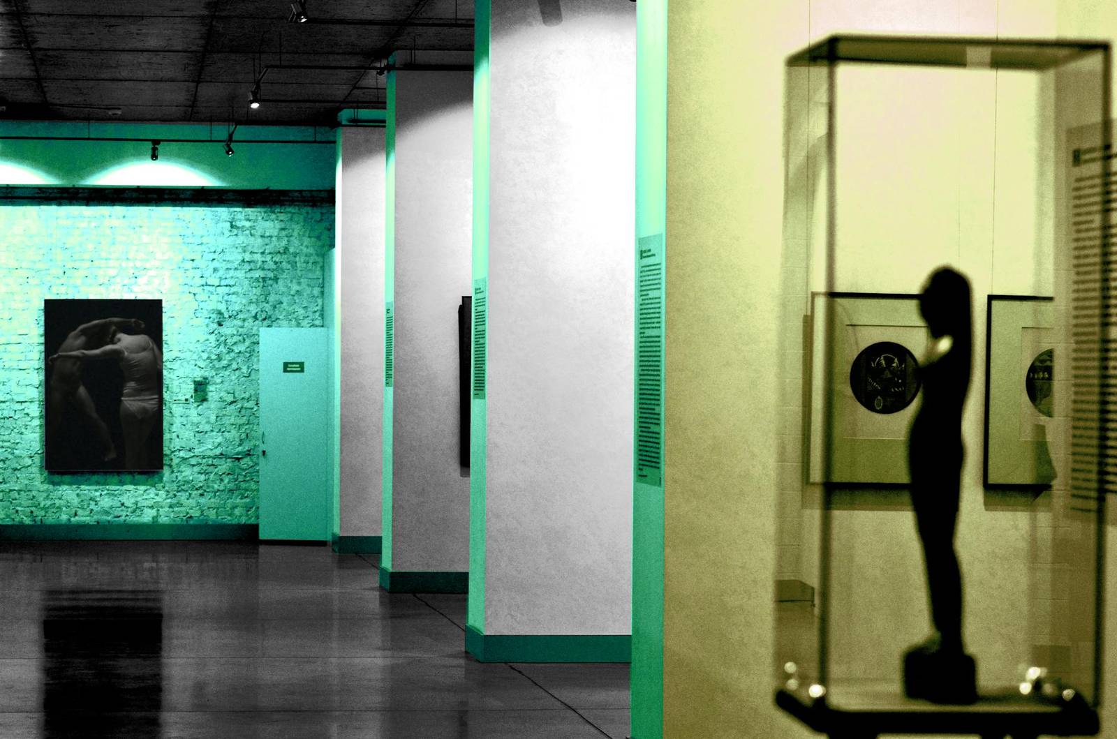 Interior of a modern art gallery with sculptures and paintings