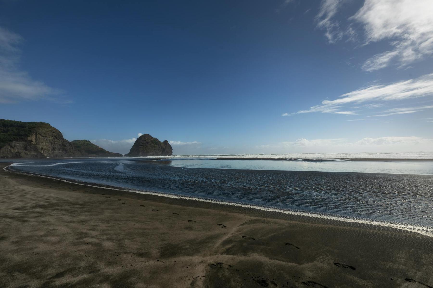 Piha Beach and Lion Rock on Auckland's west coast at sunset