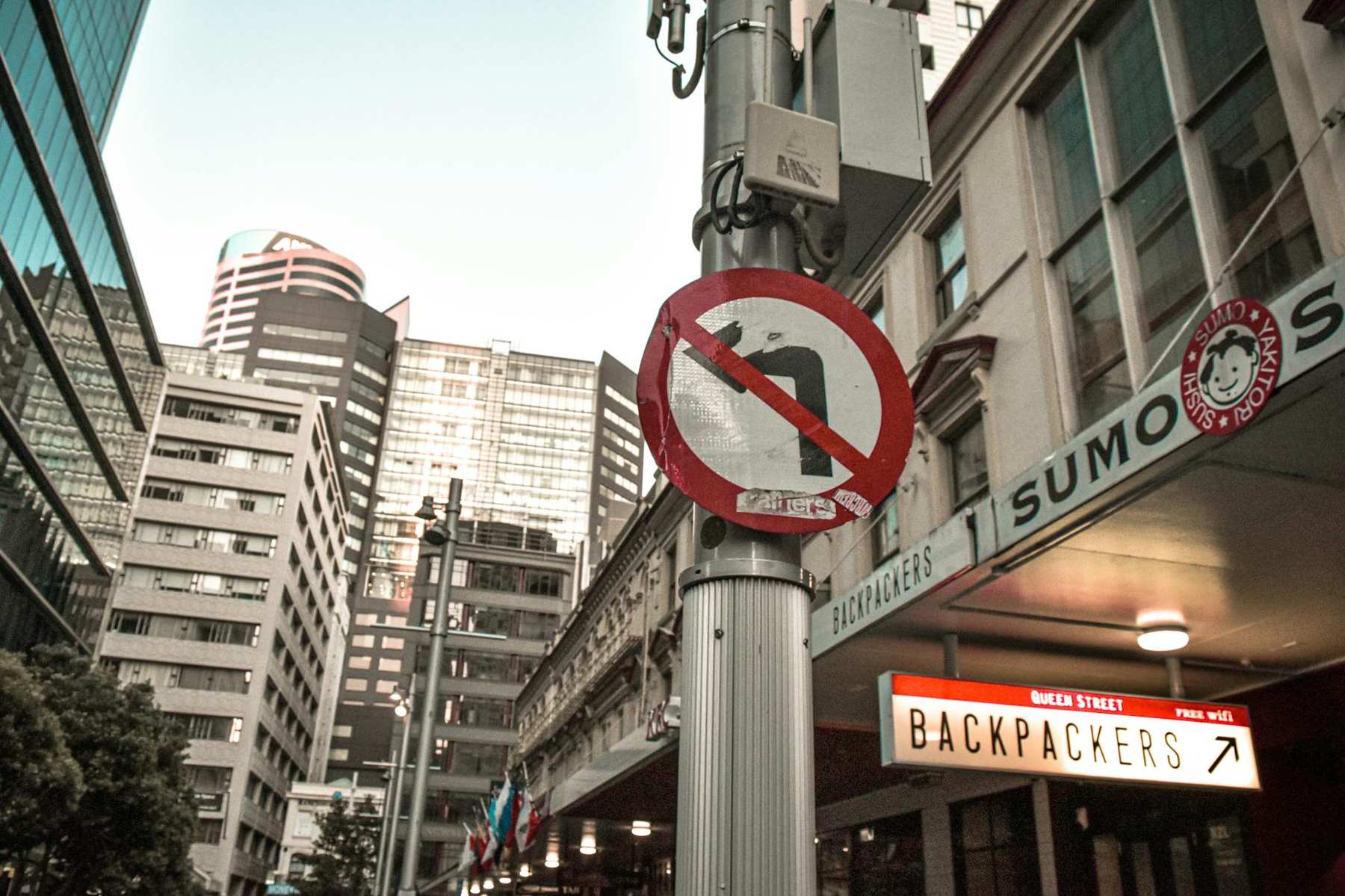 Auckland Queen Street CBD by day with shops and shoppers