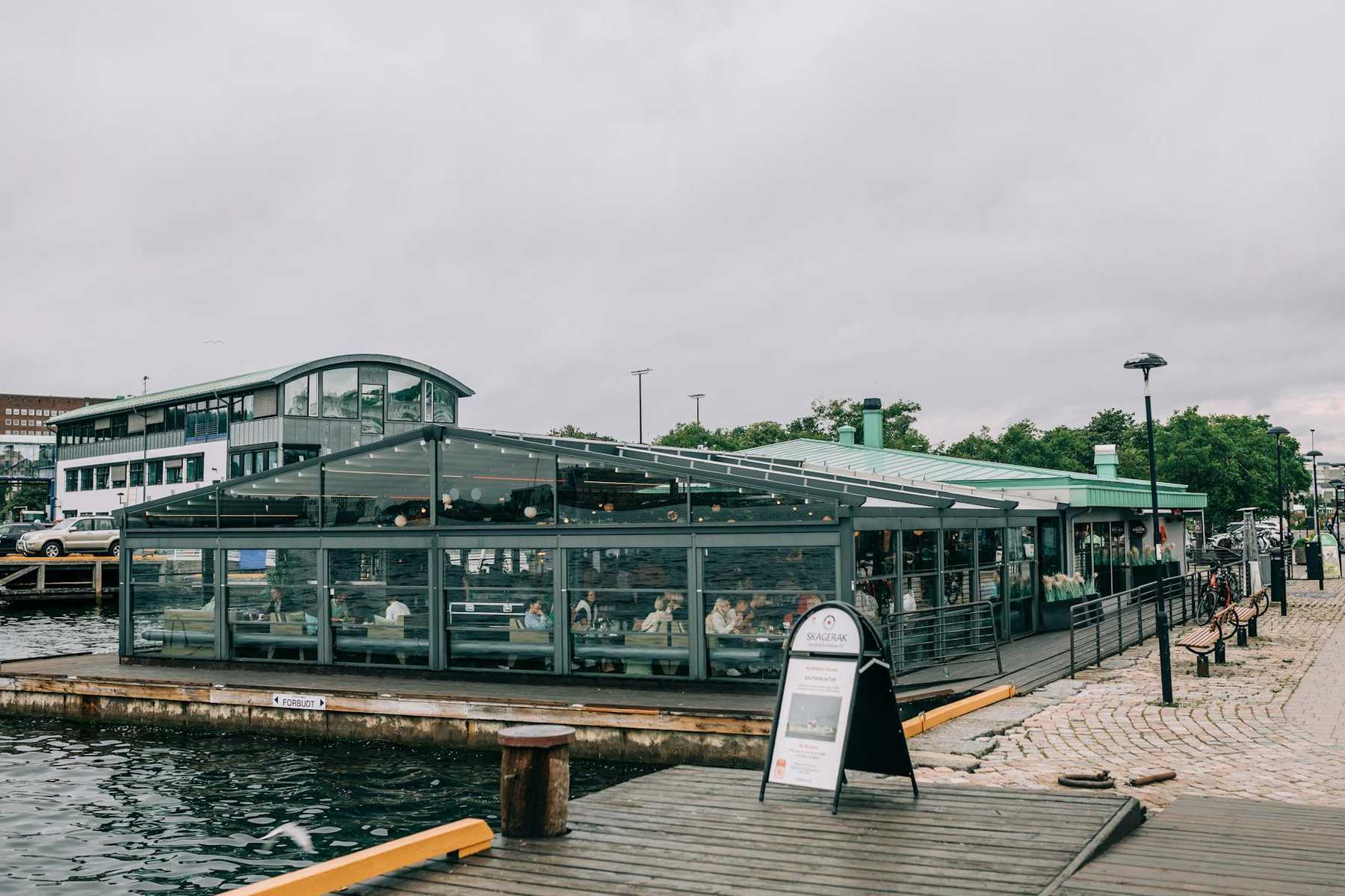 Waterfront restaurant terrace overlooking a harbour like Auckland's Viaduct