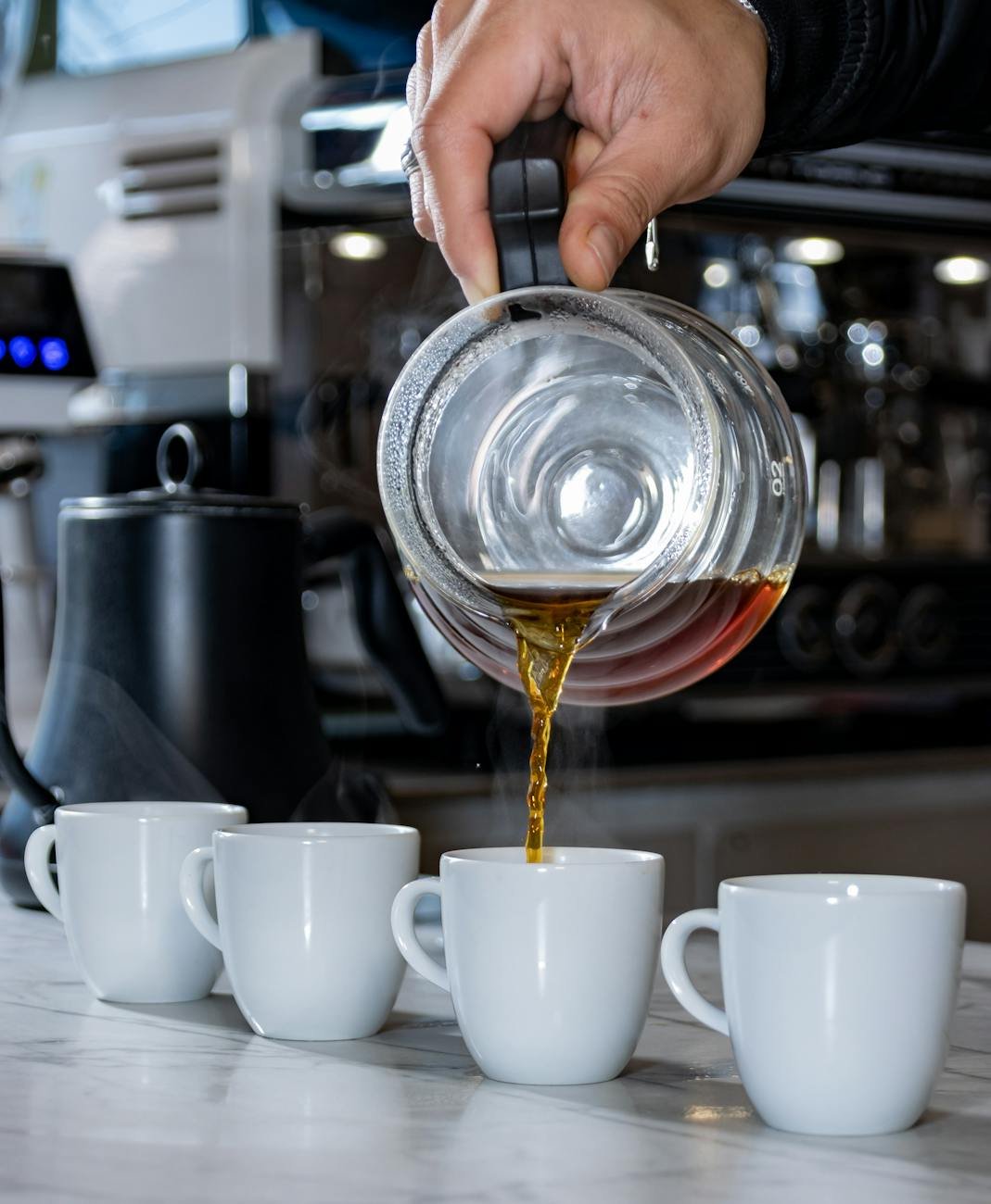 Barista pouring espresso shot for a coffee at an Auckland cafe