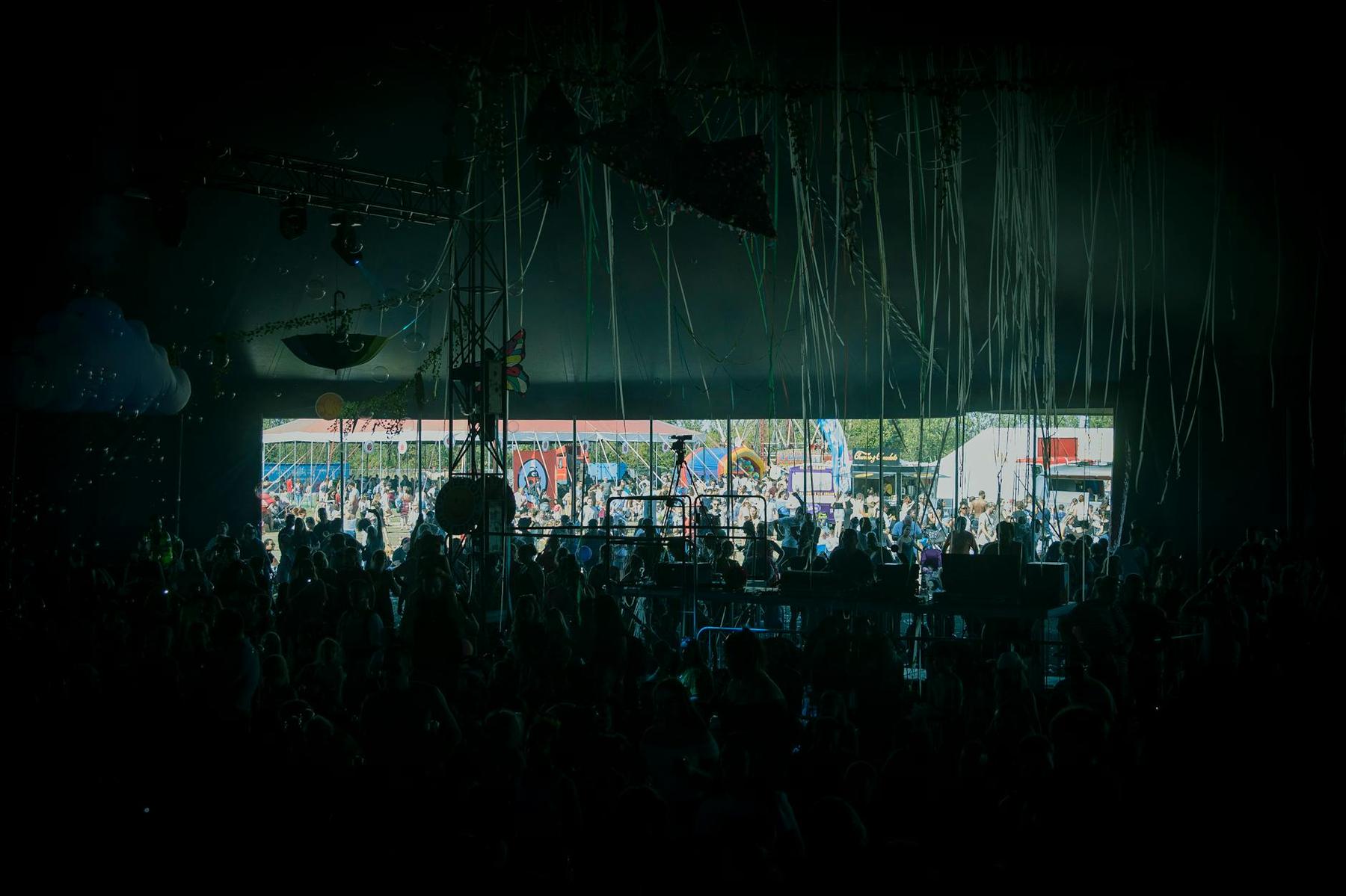 Outdoor summer music festival with crowd at Tāpapakanga Regional Park