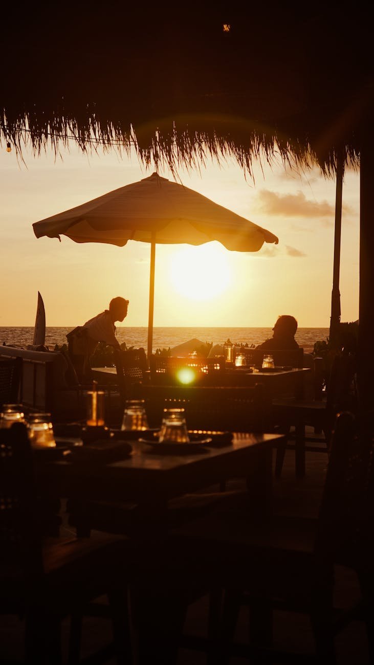 Beachfront restaurant with outdoor dining at sunset