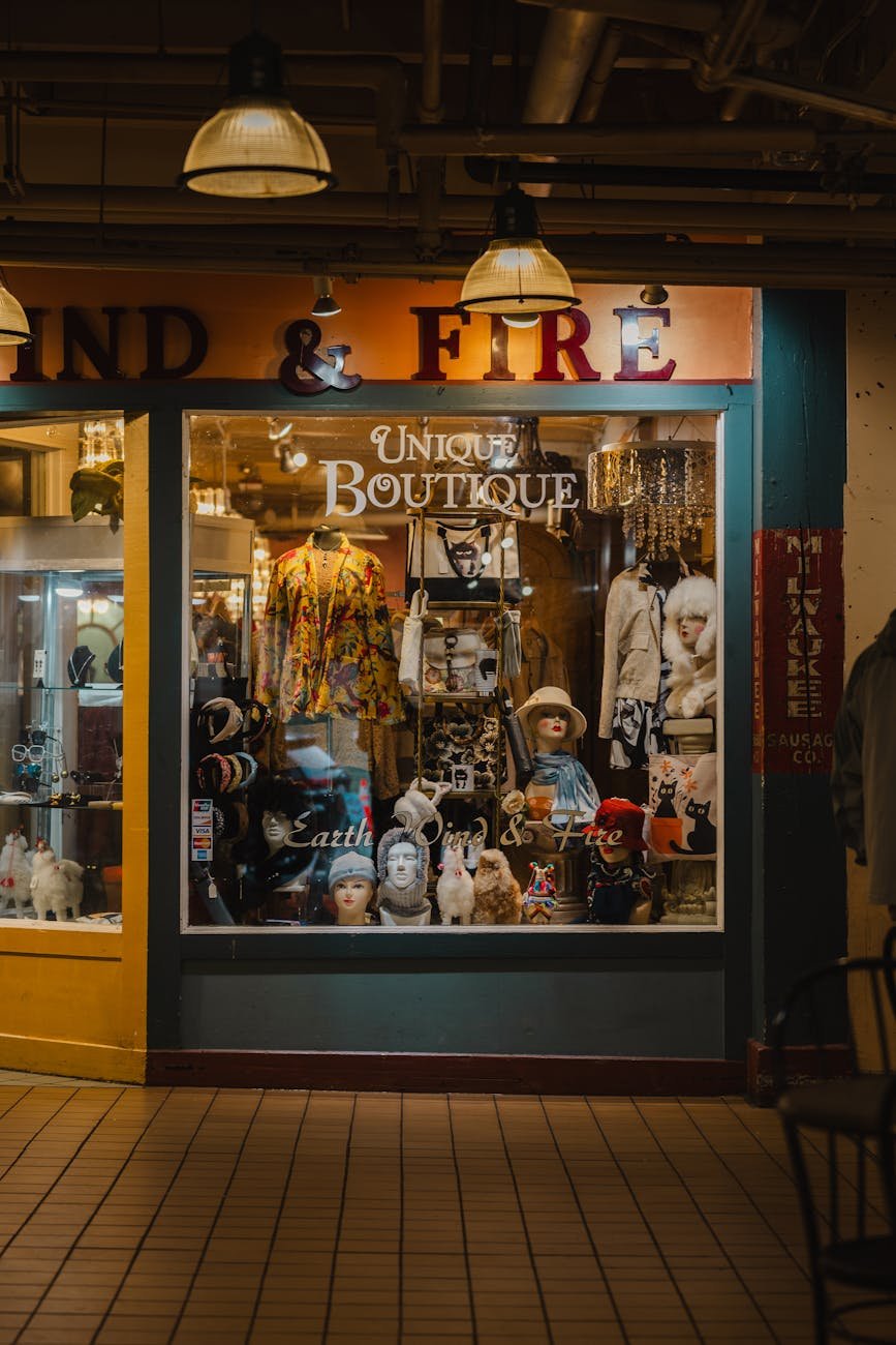 Boutique fashion shopping street with displays and design-led storefronts