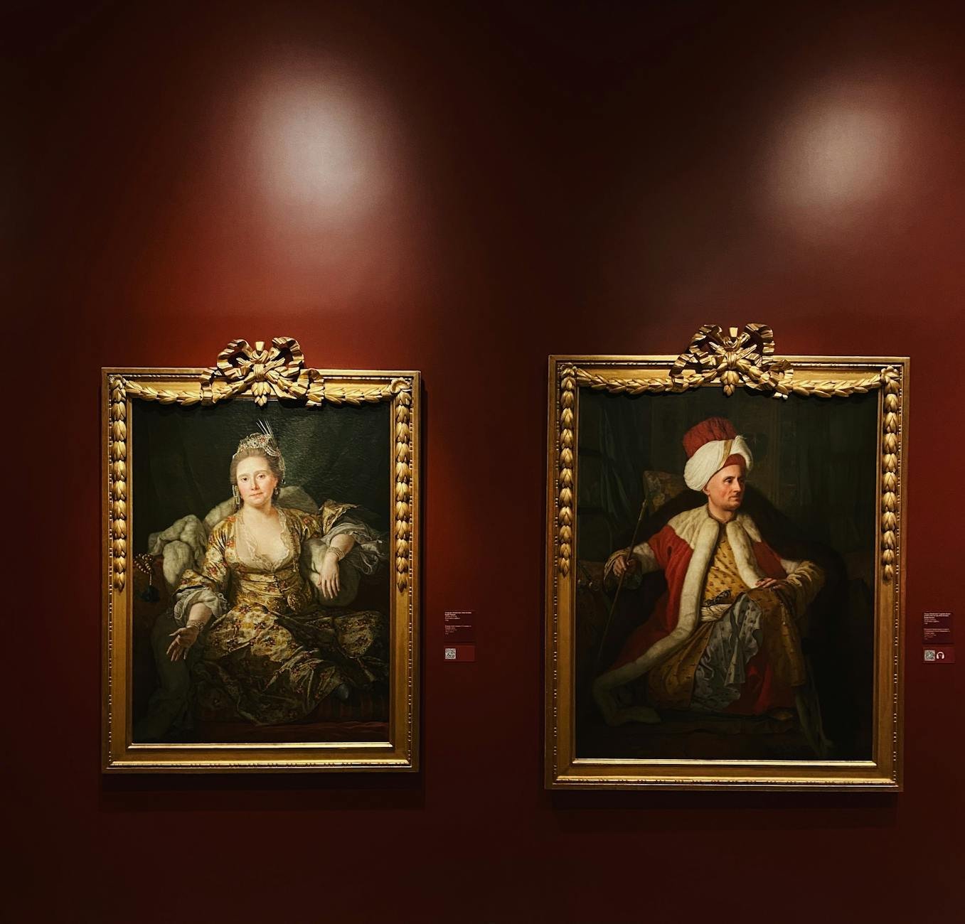 Historic painted portraits in art gallery setting
