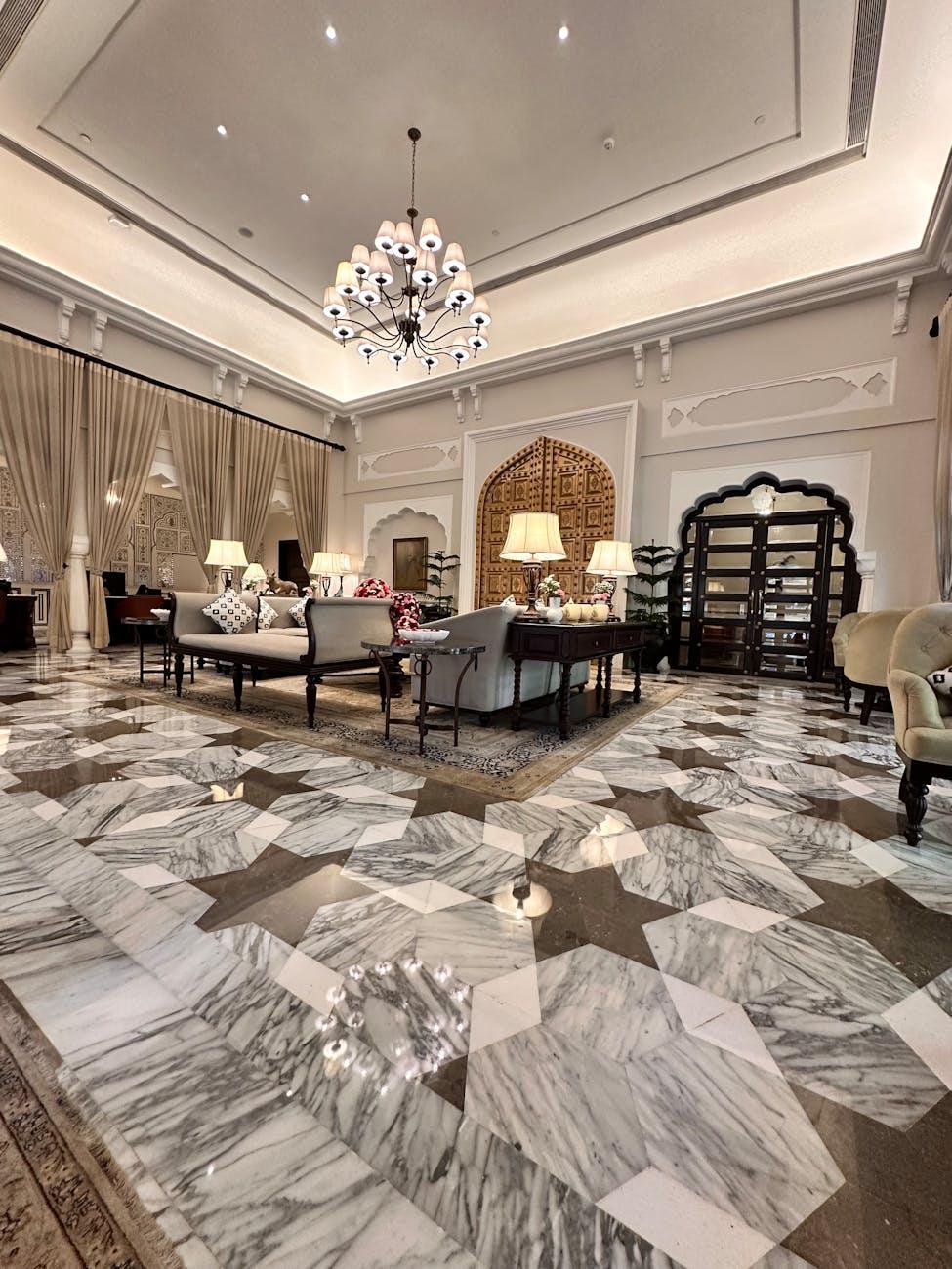 Marble luxury hotel lobby with chandelier and elegant design