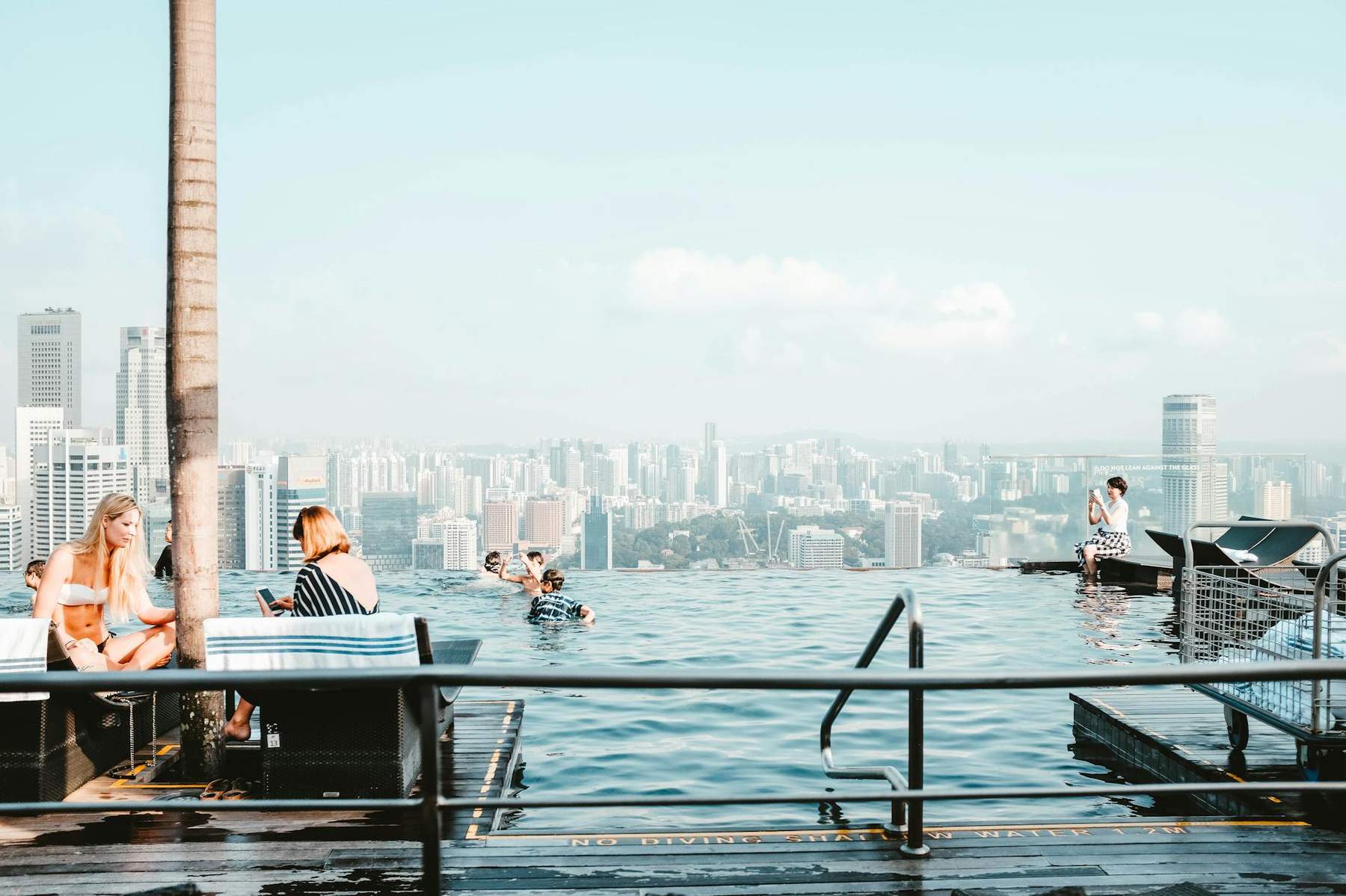 Luxury hotel rooftop infinity pool with harbour views