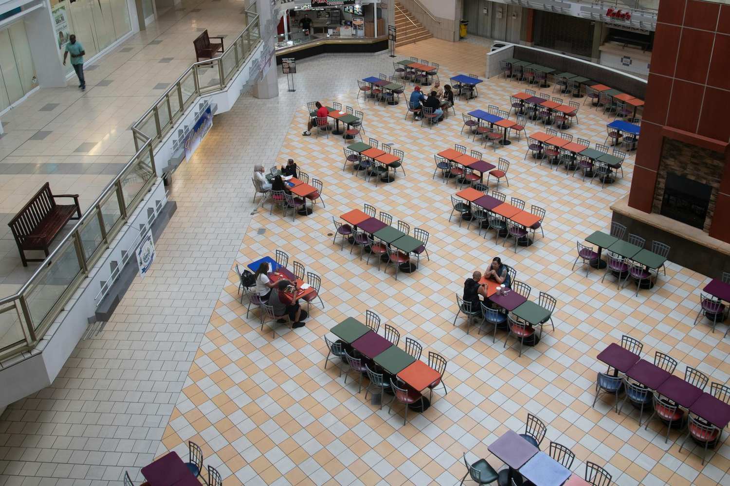 Mall food court with diverse dining options and seating