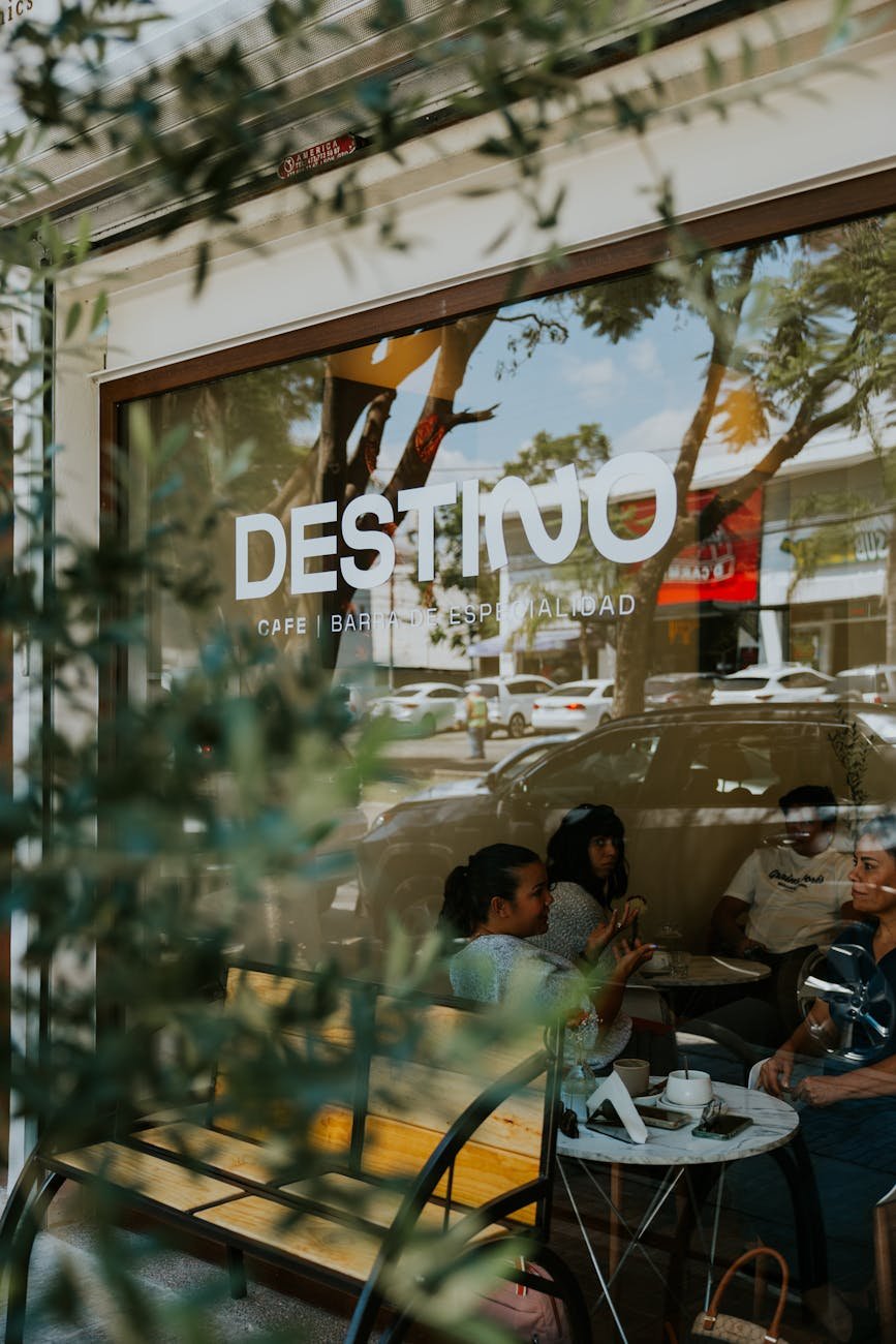 Friends having brunch at an Auckland cafe outdoor terrace