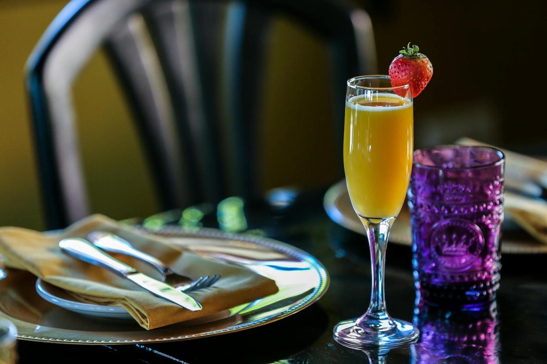 Mimosa champagne glass with orange at brunch