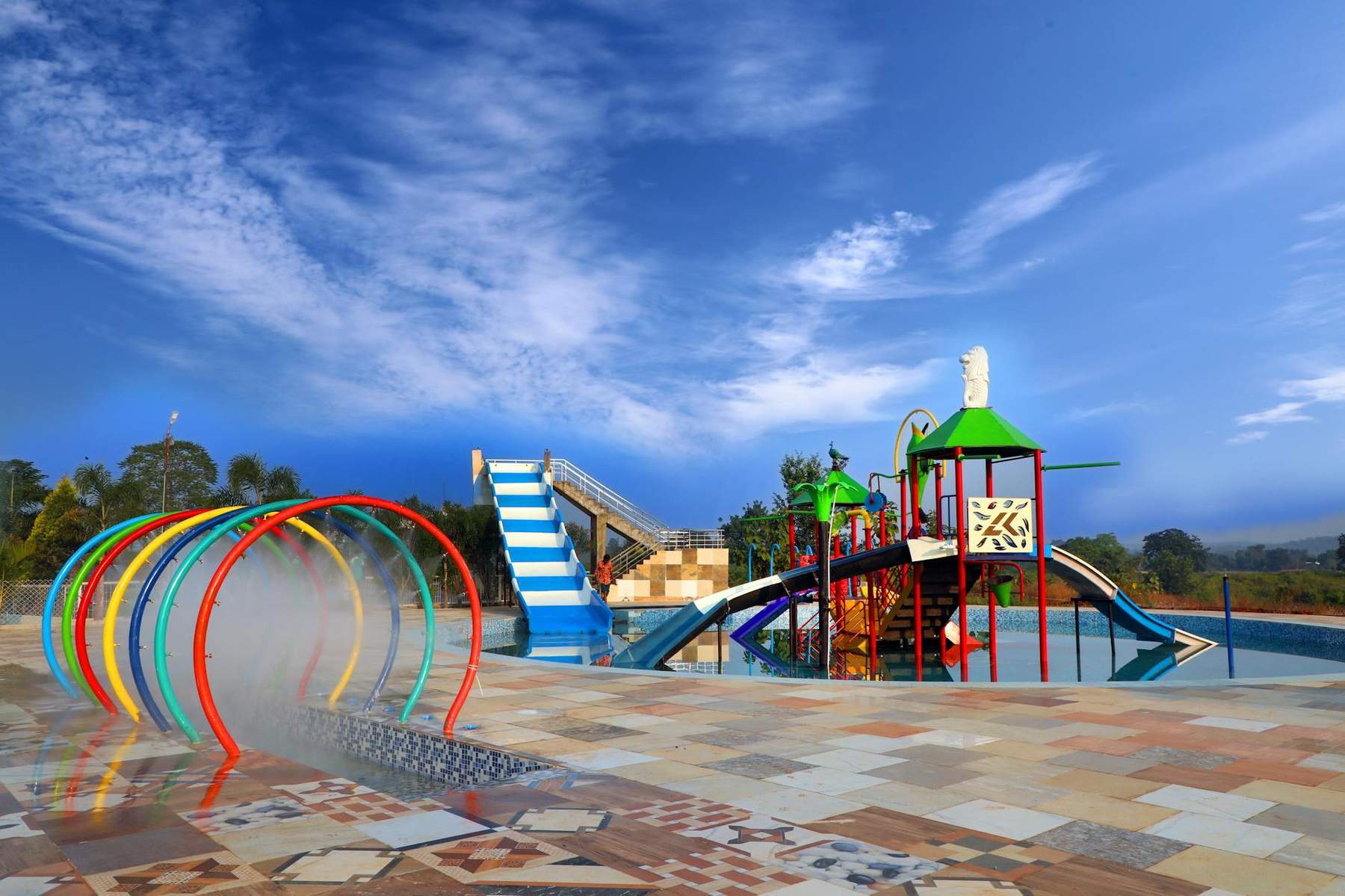 Children playing at a splash pad water playground