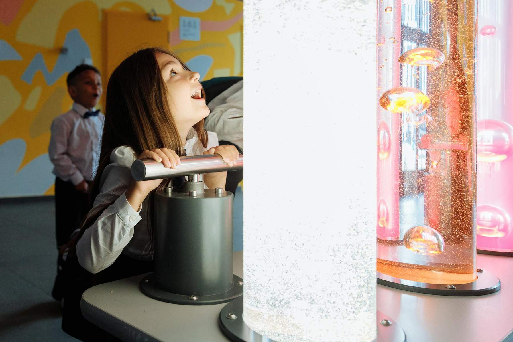 Children at interactive science exhibits in an Auckland museum