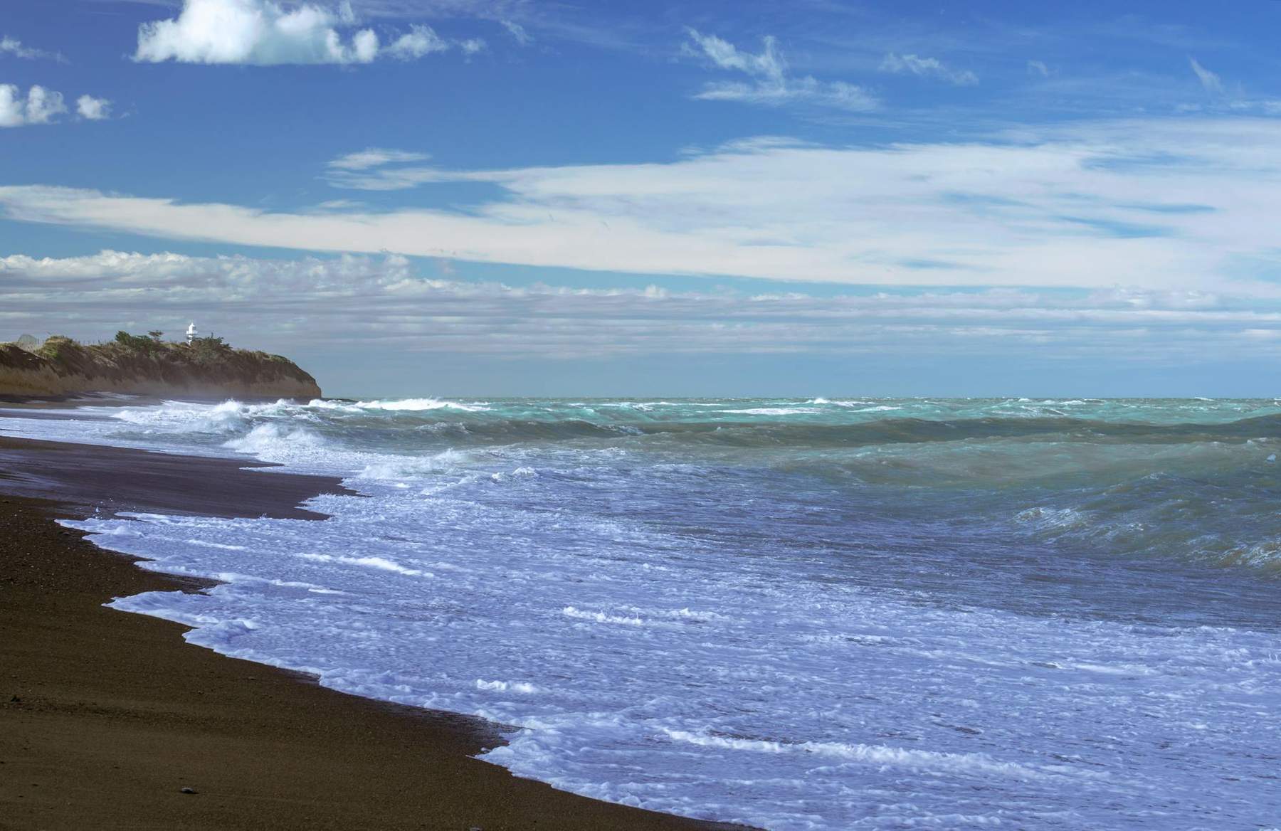Sunset over the Tasman Sea at Piha Beach Auckland