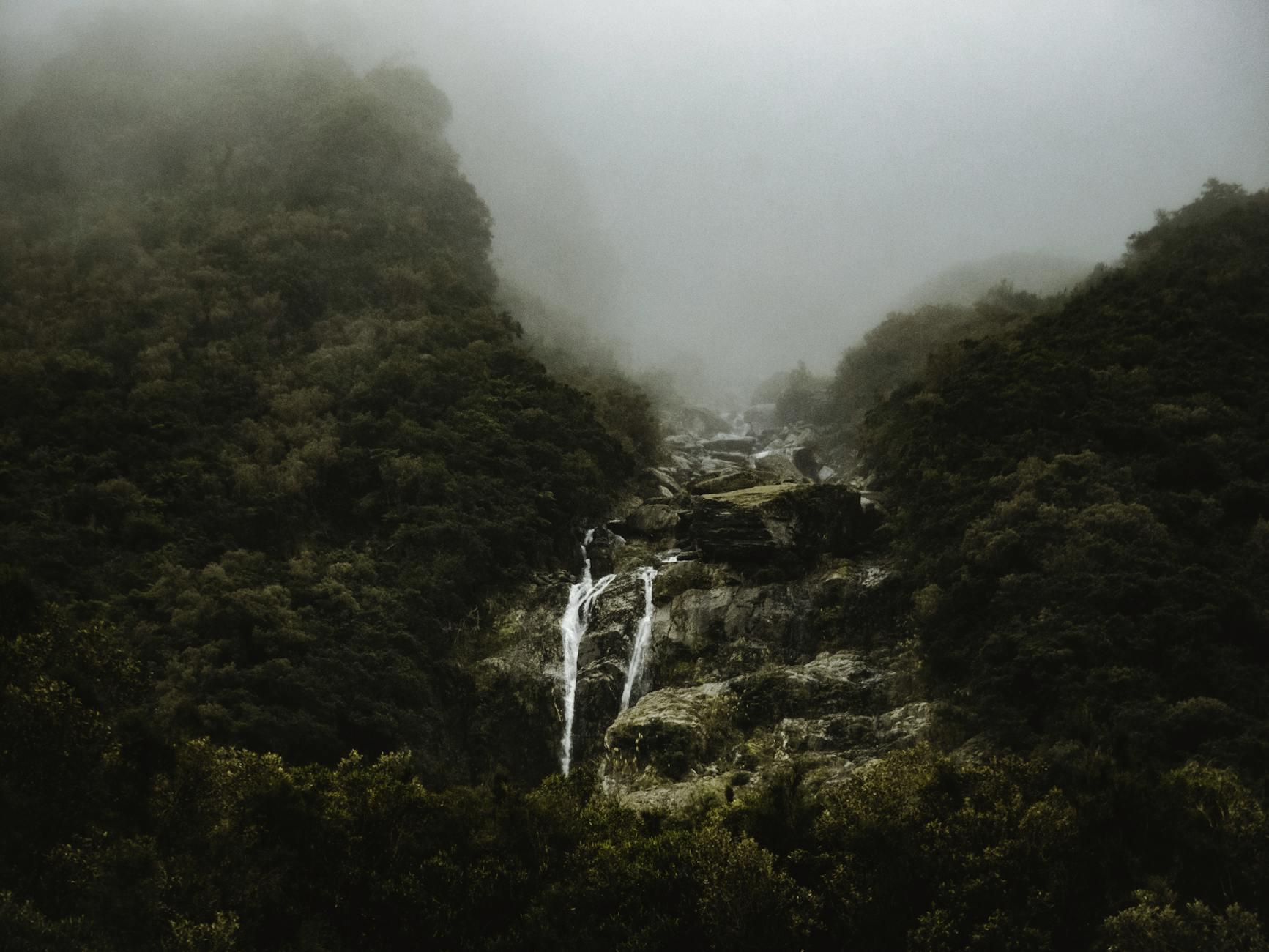 Kitekite Falls three-tier waterfall in native bush near Piha