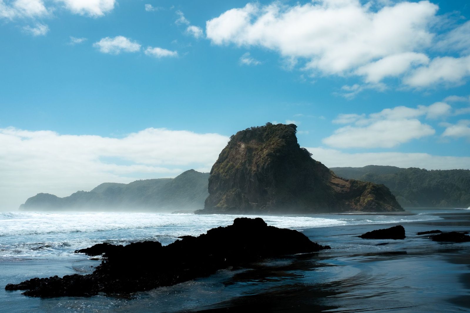 One of the best beaches in Auckland, Piha's black sand and Lion Rock on the west coast