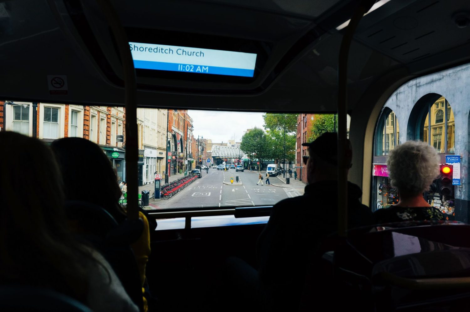 Double-decker Link bus carrying passengers through central Auckland