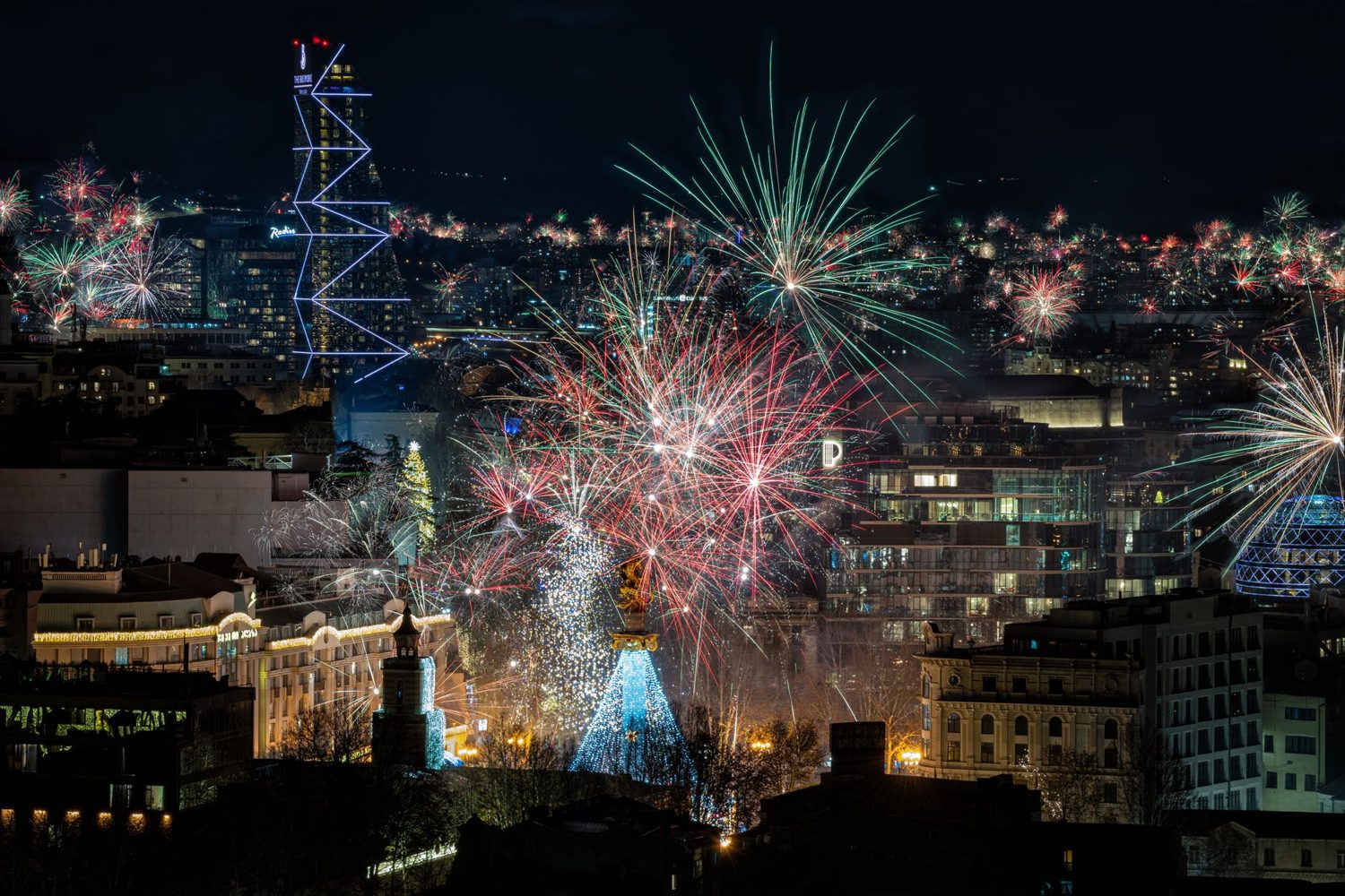 New Year fireworks over the Auckland CBD skyline and Sky Tower