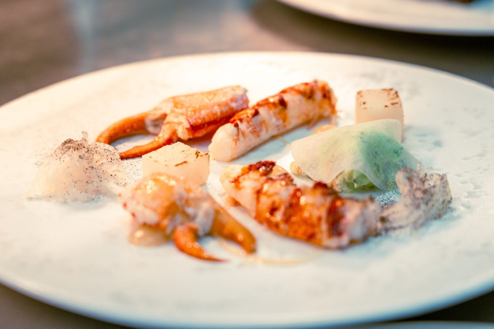 A plated tasting-menu course at an Auckland fine dining restaurant