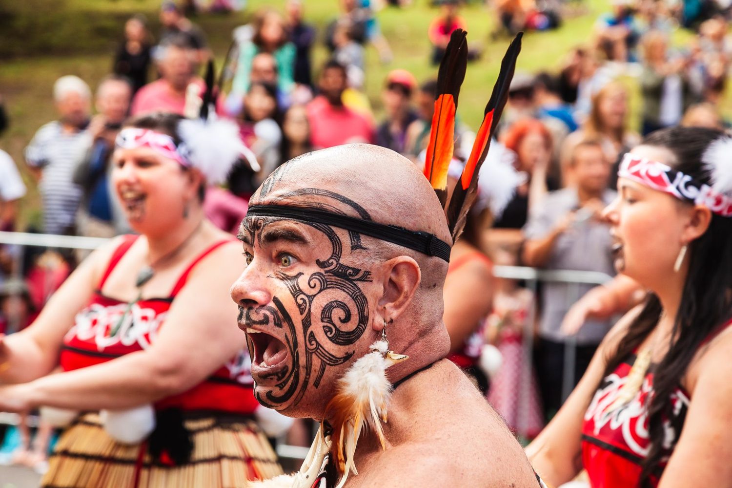 Maori cultural performers presenting a haka to an audience
