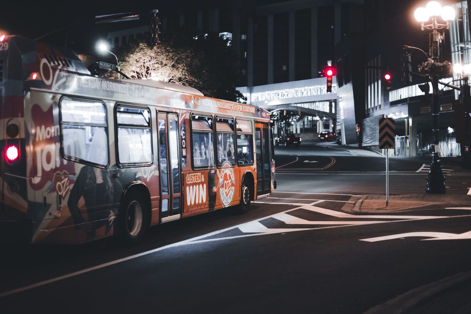 AT HOP card and Auckland public transport bus on a city street