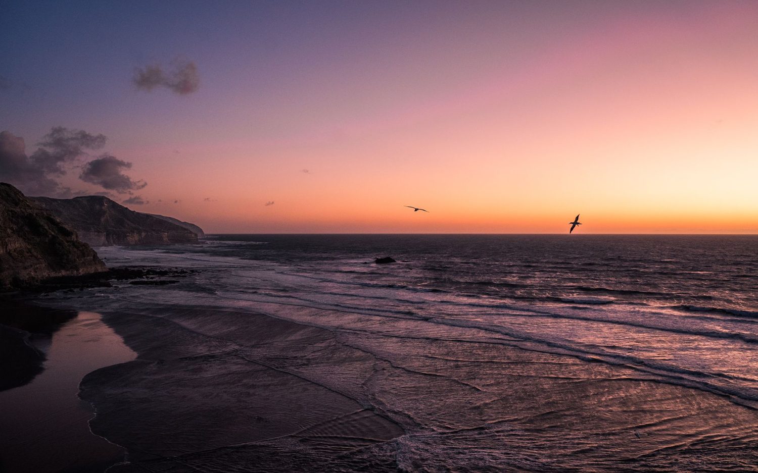 Sunset over the Tasman Sea from Bethells Beach