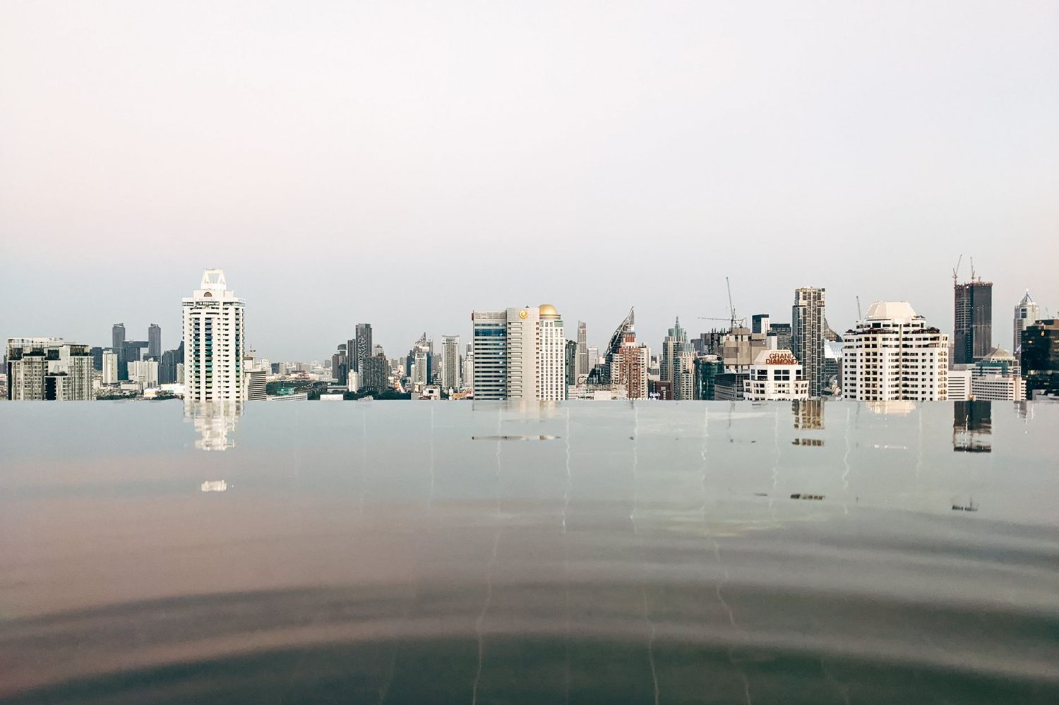 Hotel pool overlooking the Auckland city skyline