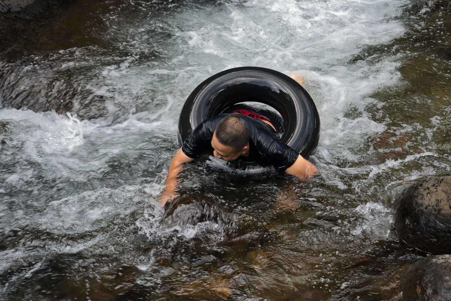 Black water rafting through a Waitomo cave on an inner tube