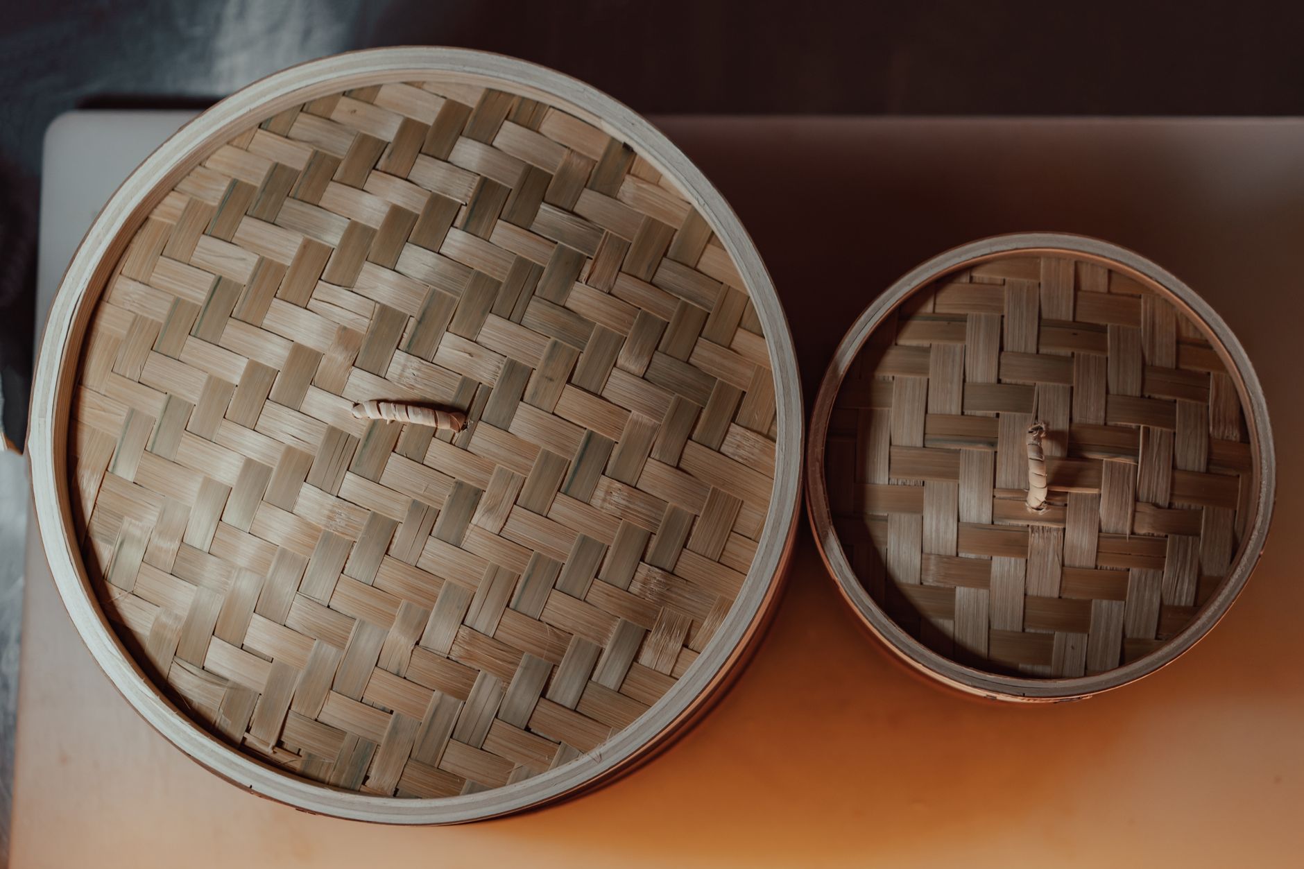 Steamed dumplings in a bamboo basket at an Auckland yum cha restaurant