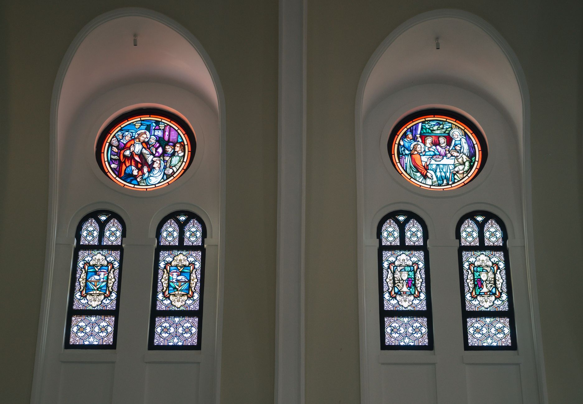 Stained glass windows in a historic church interior