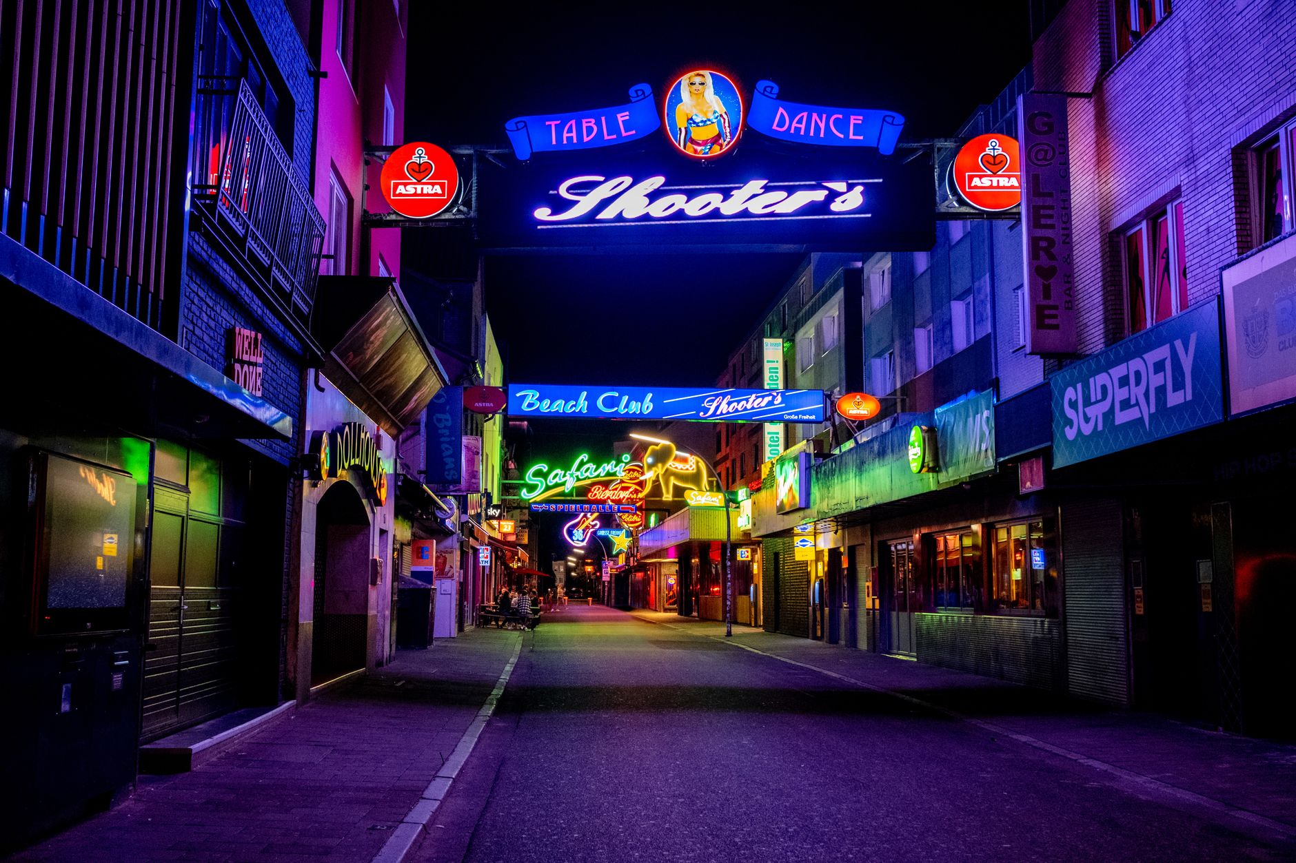 Neon signs on Karangahape Road bars at night
