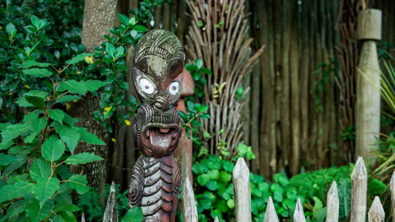 Traditional Maori carving in a New Zealand garden setting