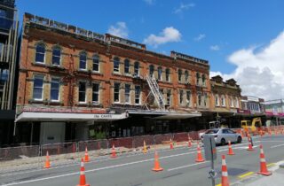 Victorian brick terraces with shopfronts along Karangahape Road in Auckland