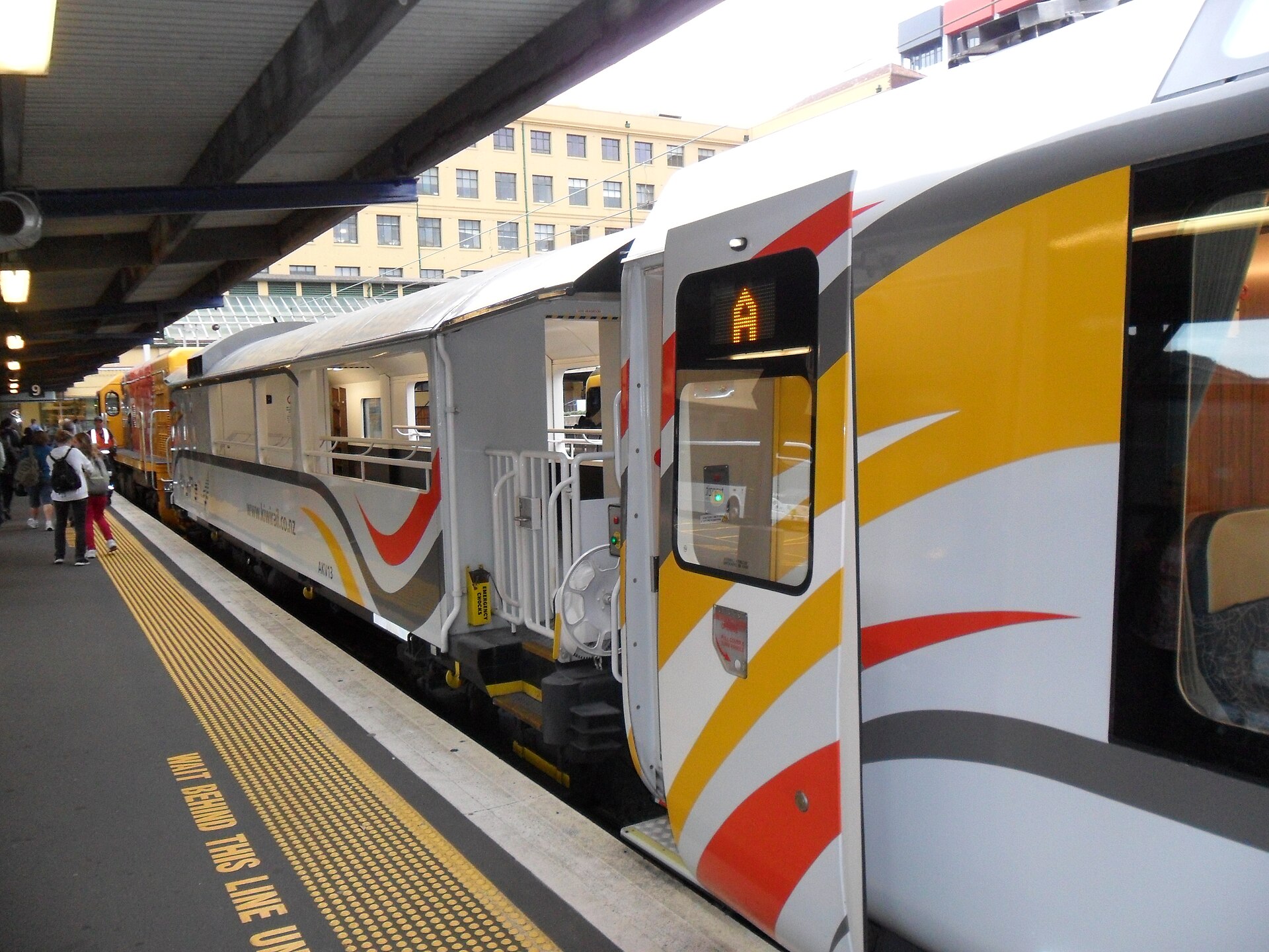 KiwiRail's scenic passenger carriages standing at a platform at Wellington Station