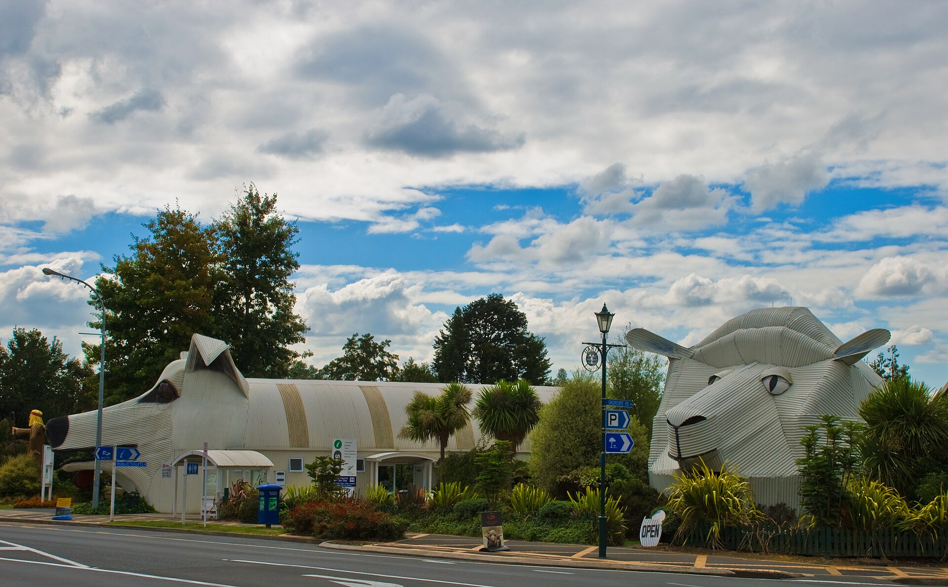 The corrugated-iron dog and sheep buildings beside the main road in Tīrau